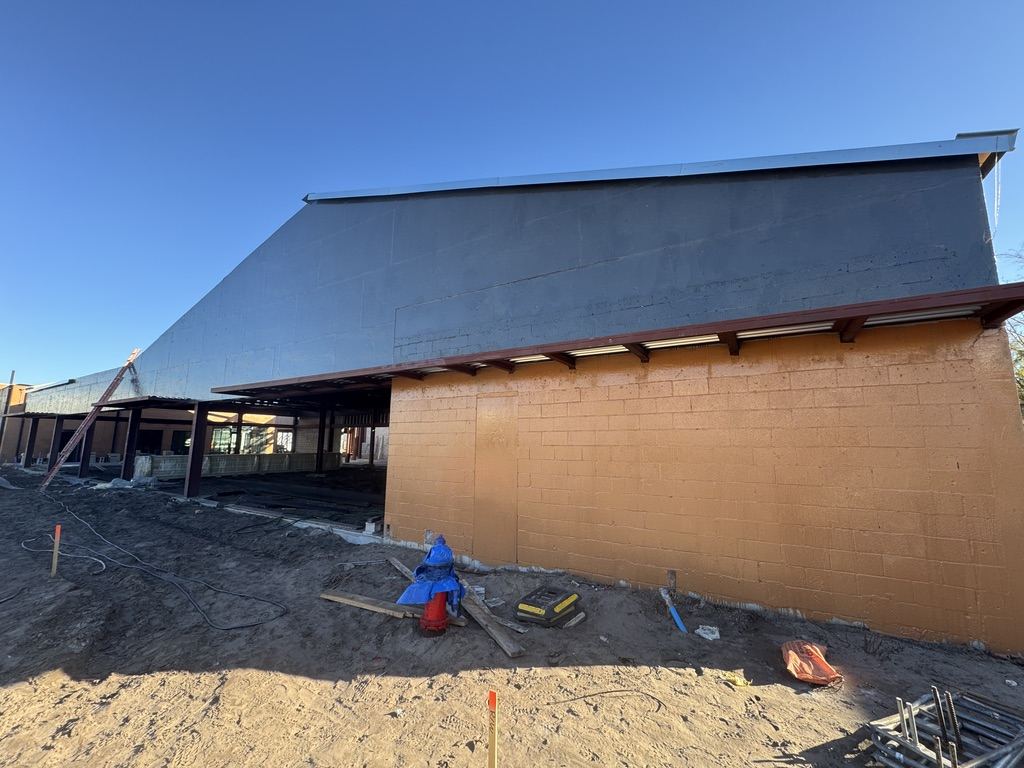 Air barrier installation on a CMU commercial build