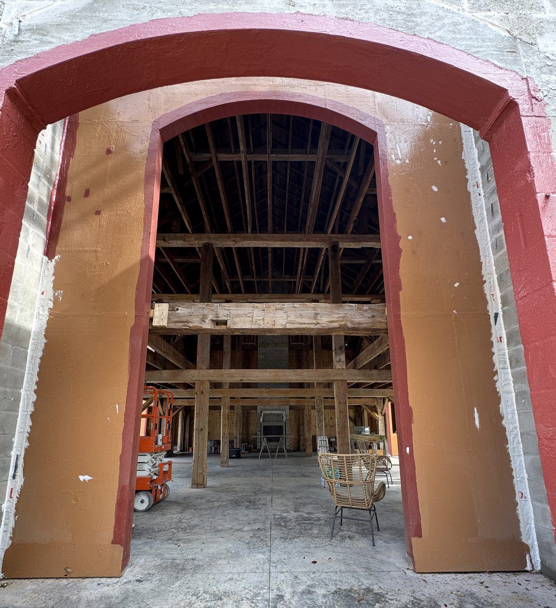 Coated archway and interior framing beneath a vaulted roof structure